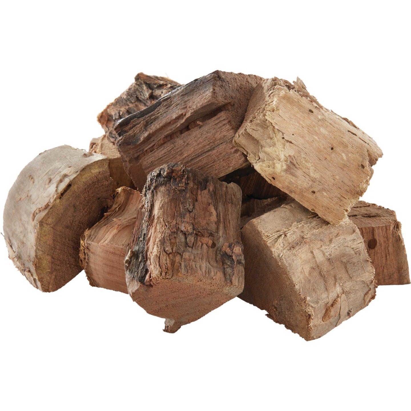 Pile of natural mesquite wood chunks in varied shapes and textures for smoking and grilling use