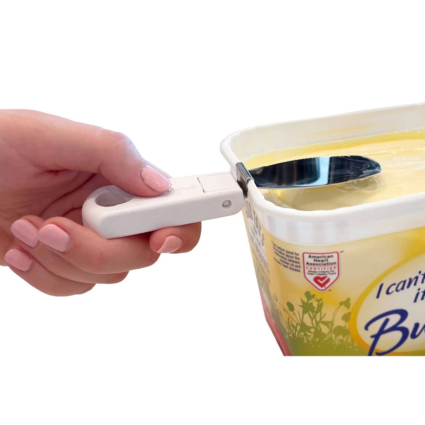 Hand holding white collapsible handle butter knife snapping onto yellow plastic spreadable butter tub in kitchen gadgets under $50 collection