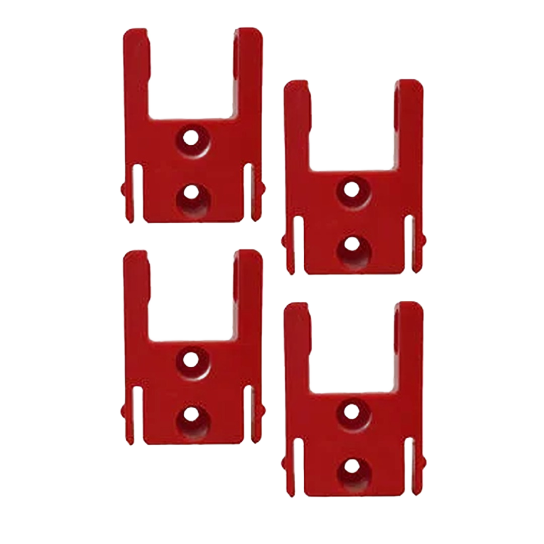 Set of four red injection molded plastic mounts for organizing cordless tools in workshop storage systems