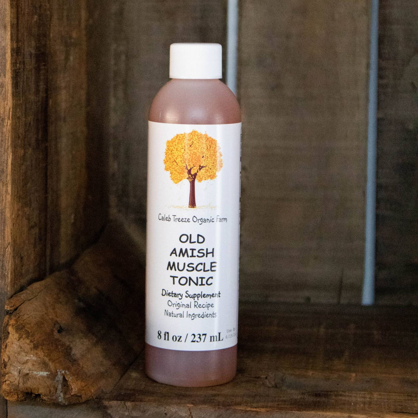 Bottle of Old Amish Muscle Tonic dietary supplement with natural ingredients for muscle relief in Health & Beauty collection