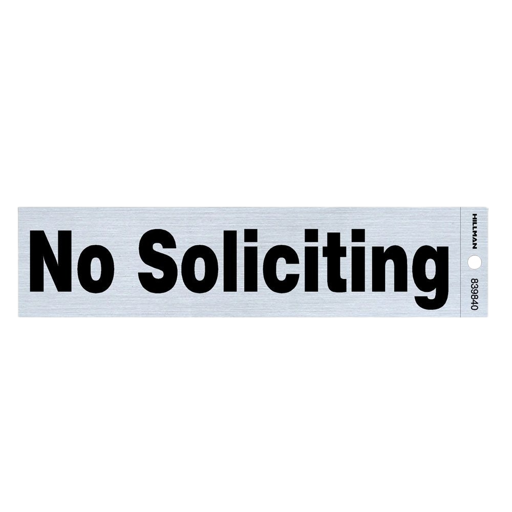 Rectangular gray and black nickel mylar sign with bold "No Soliciting" text and a small mounting hole on the side