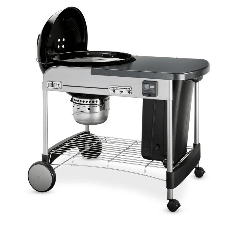 Weber black charcoal grill with side prep table, storage rack, and integrated fire control for outdoor grilling and lawn garden use