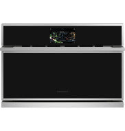 Stainless steel minimalist five-in-one wall oven with digital display and black glass front in modern kitchen setting