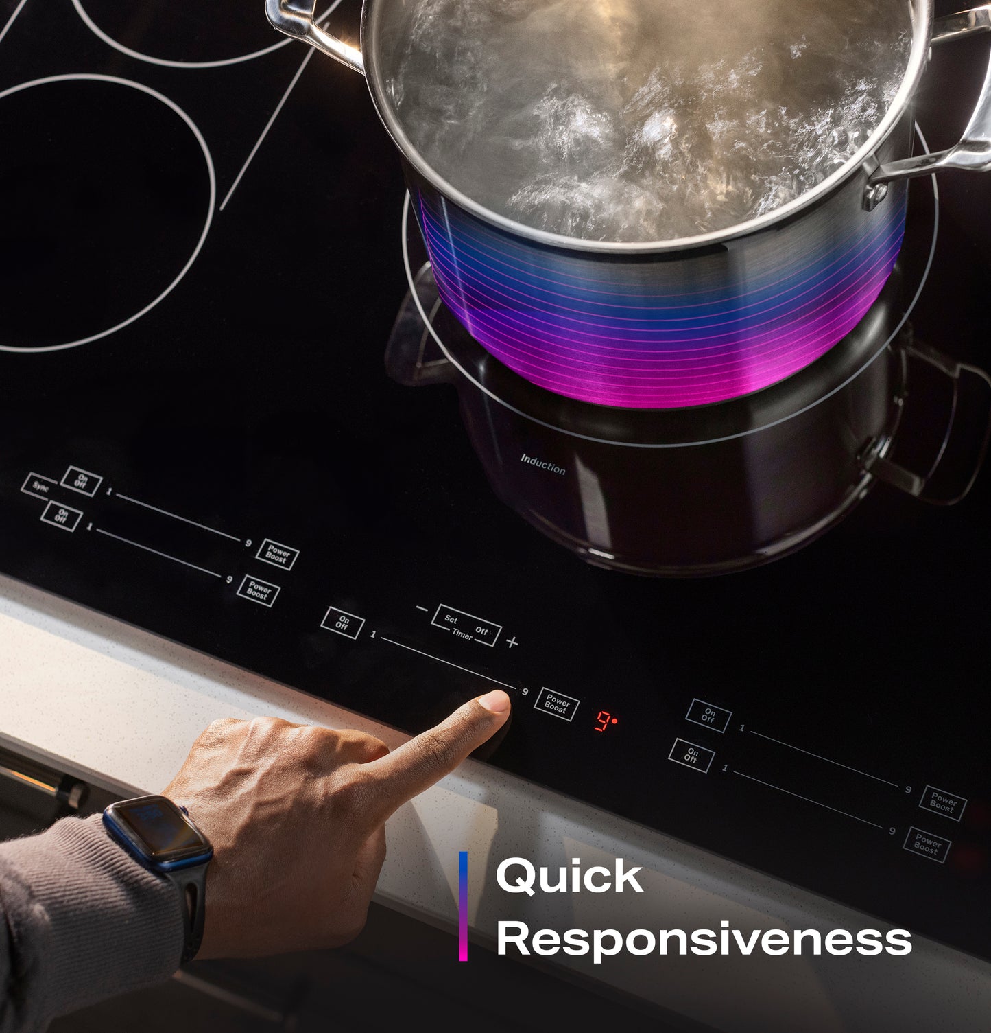 Person adjusting temperature on black built-in touch control induction cooktop with boiling pot in kitchen setting