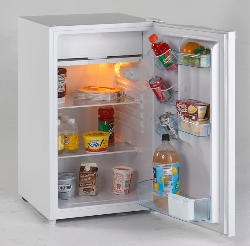 White counterhigh refrigerator with freezer section, stocked with beverages, dairy, and snacks in kitchen appliance collection