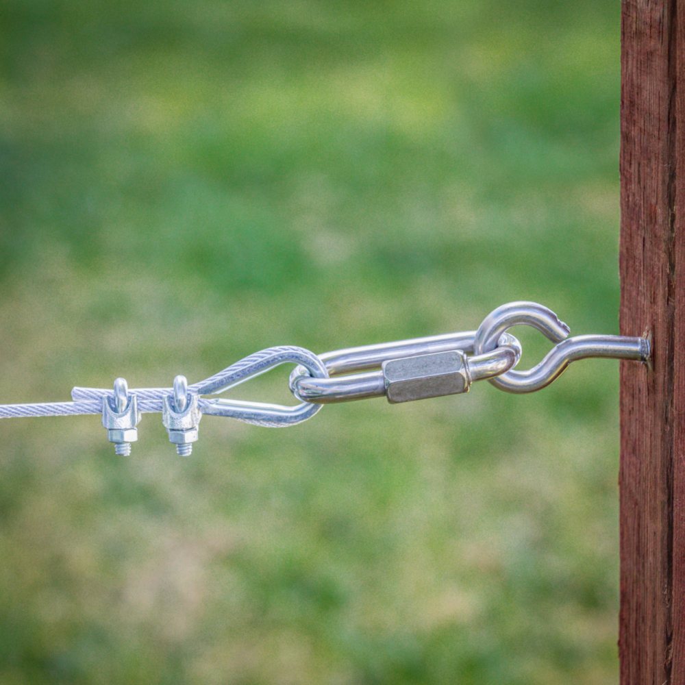 Stainless steel lag screw eye attached to wire rope with clips and turnbuckle for home improvement hardware projects under $50