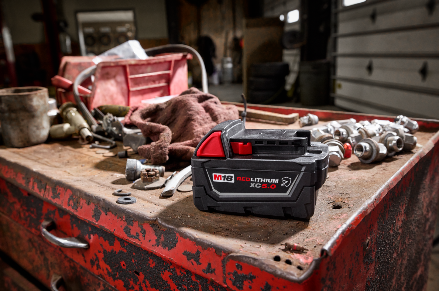 Compact black and red high-capacity rechargeable battery for power tools and home improvement projects