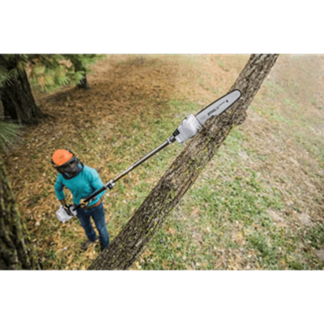 Person wearing safety gear using a long-reach pruning saw to trim a large tree branch for home improvement tasks