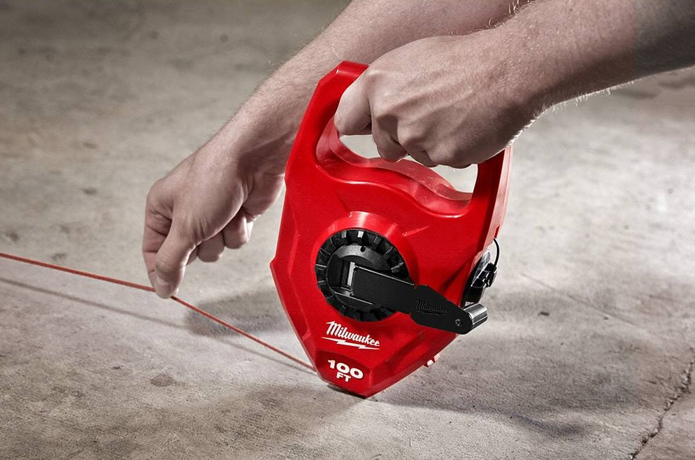 Red Milwaukee chalk reel with large capacity and planetary gear system for hand tools and woodworking measuring collections