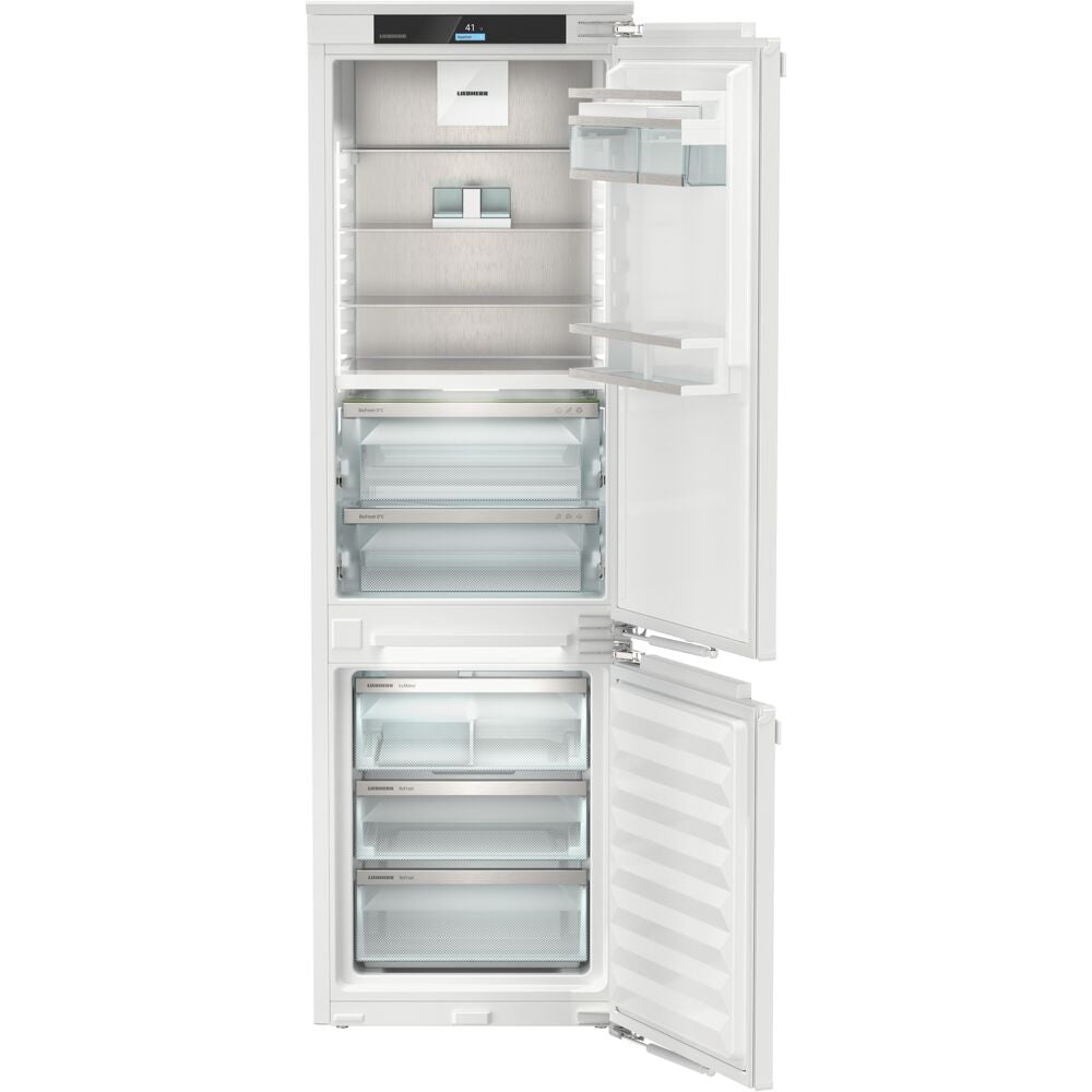 Built-in 24-inch counter-depth refrigerator with bottom freezer, glass shelves, crisper drawer, and ice maker in appliances collection