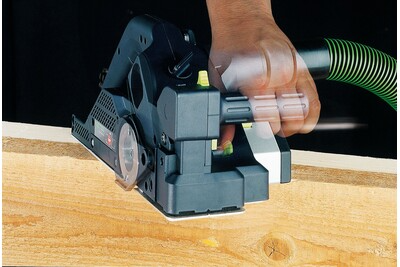 Hand operating a Festool electric planer smoothing a wooden board for precision tools and home improvement projects