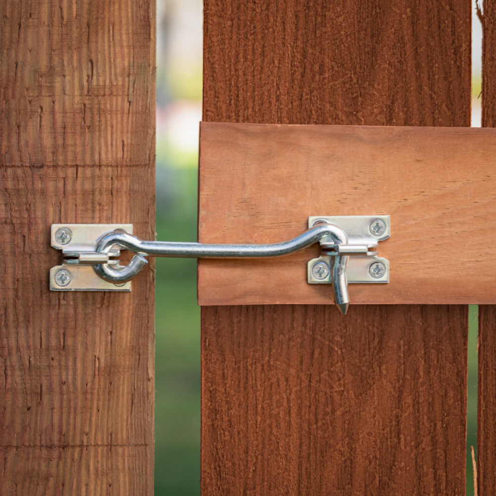 Zinc-plated 5-inch gate hook latch securing wooden gate for door accessories, hardware, and home improvement under $50 collection