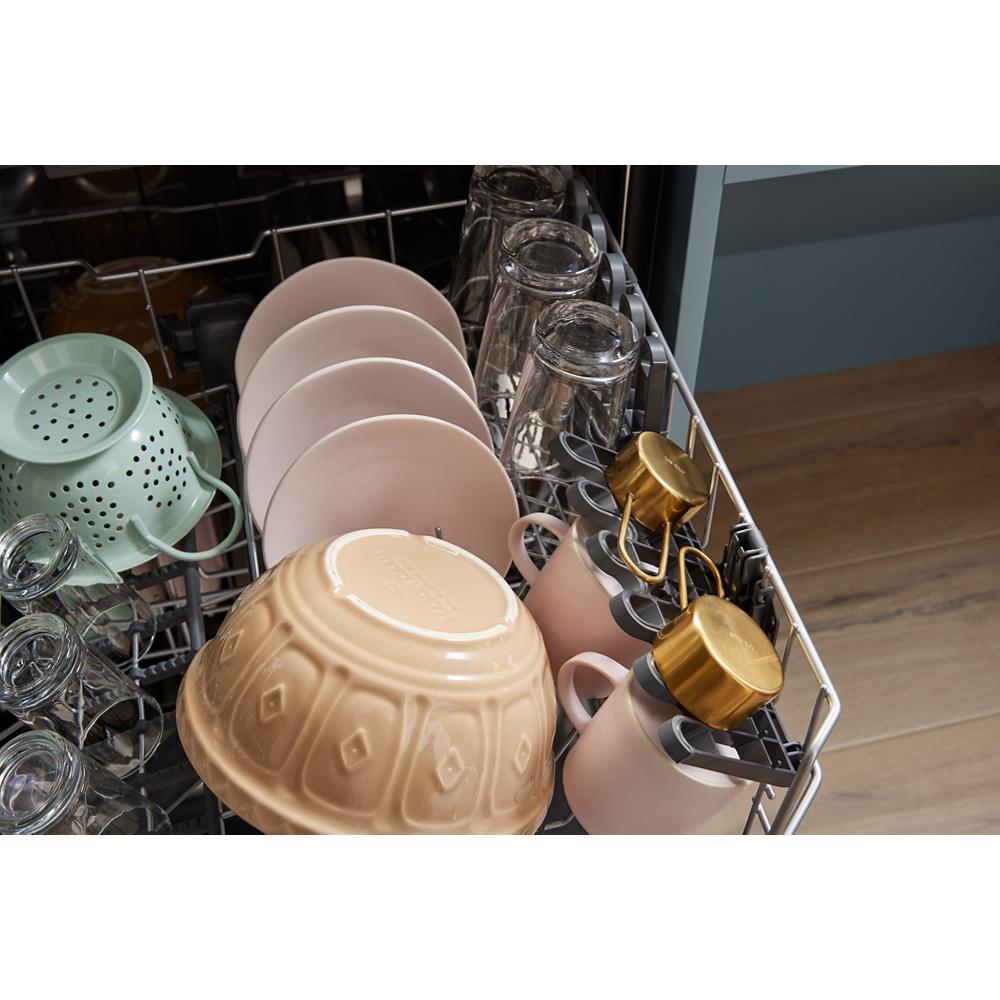 Open dishwasher rack loaded with glasses, plates, bowls, and mugs from kitchen appliances collection