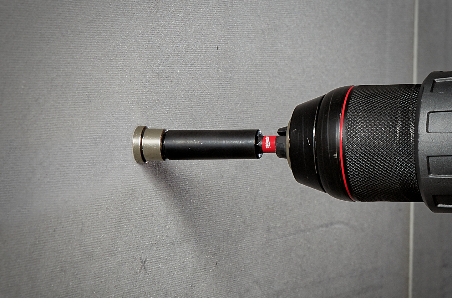 Drywall screw setter with collar attached to power drill for consistent screw depth in tool accessories under $50