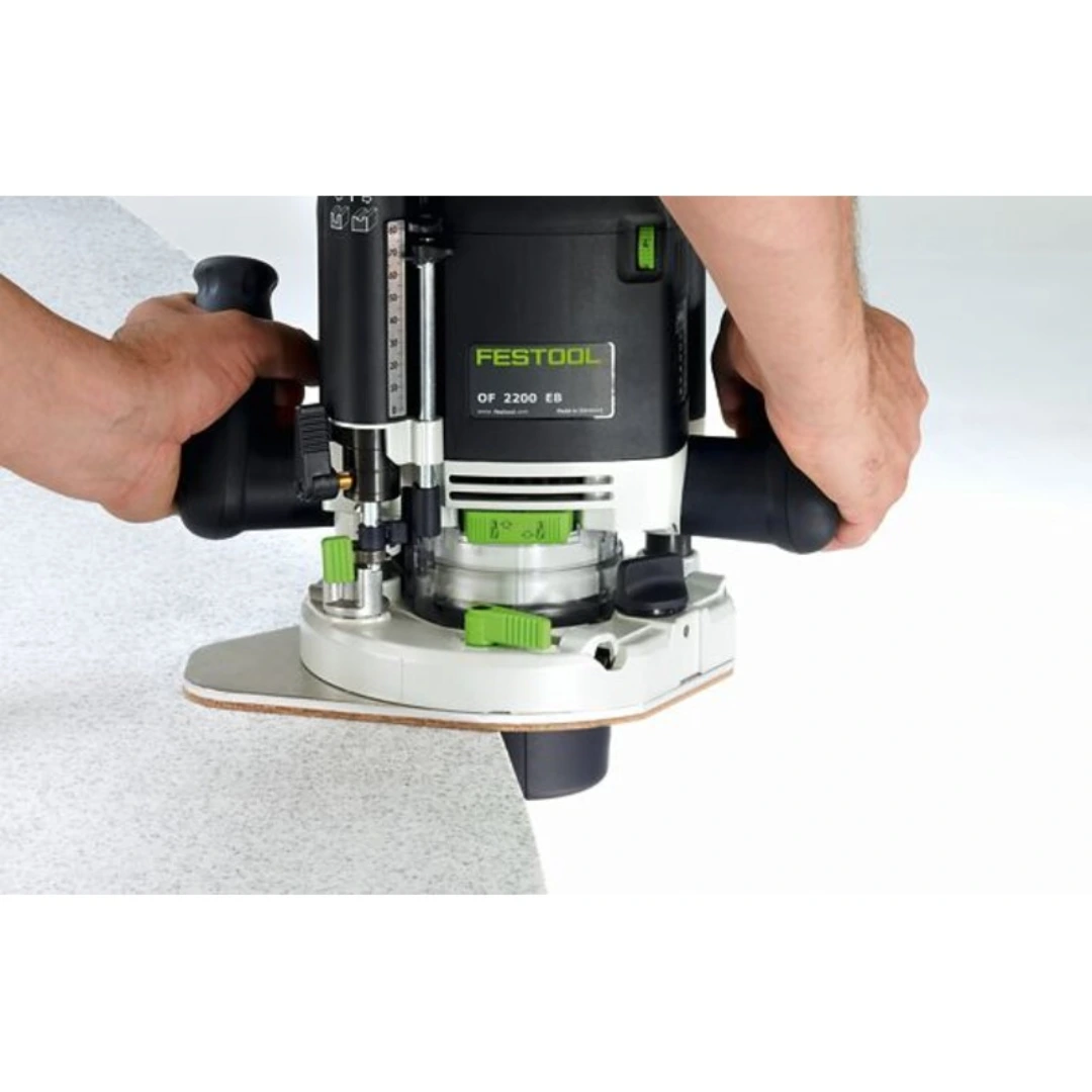 Festool router with 494682 OF 2200 base plate table widener and integrated dust hood for woodworking tool accessories.