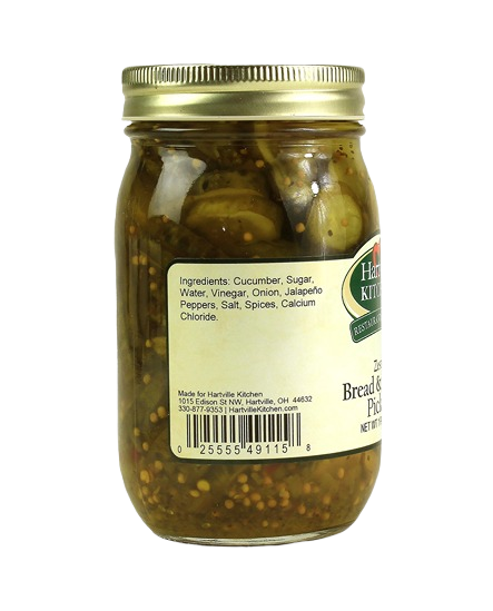 Glass jar of zesty bread and butter pickles with gold metal lid in fruits & vegetables and preserved goods collections