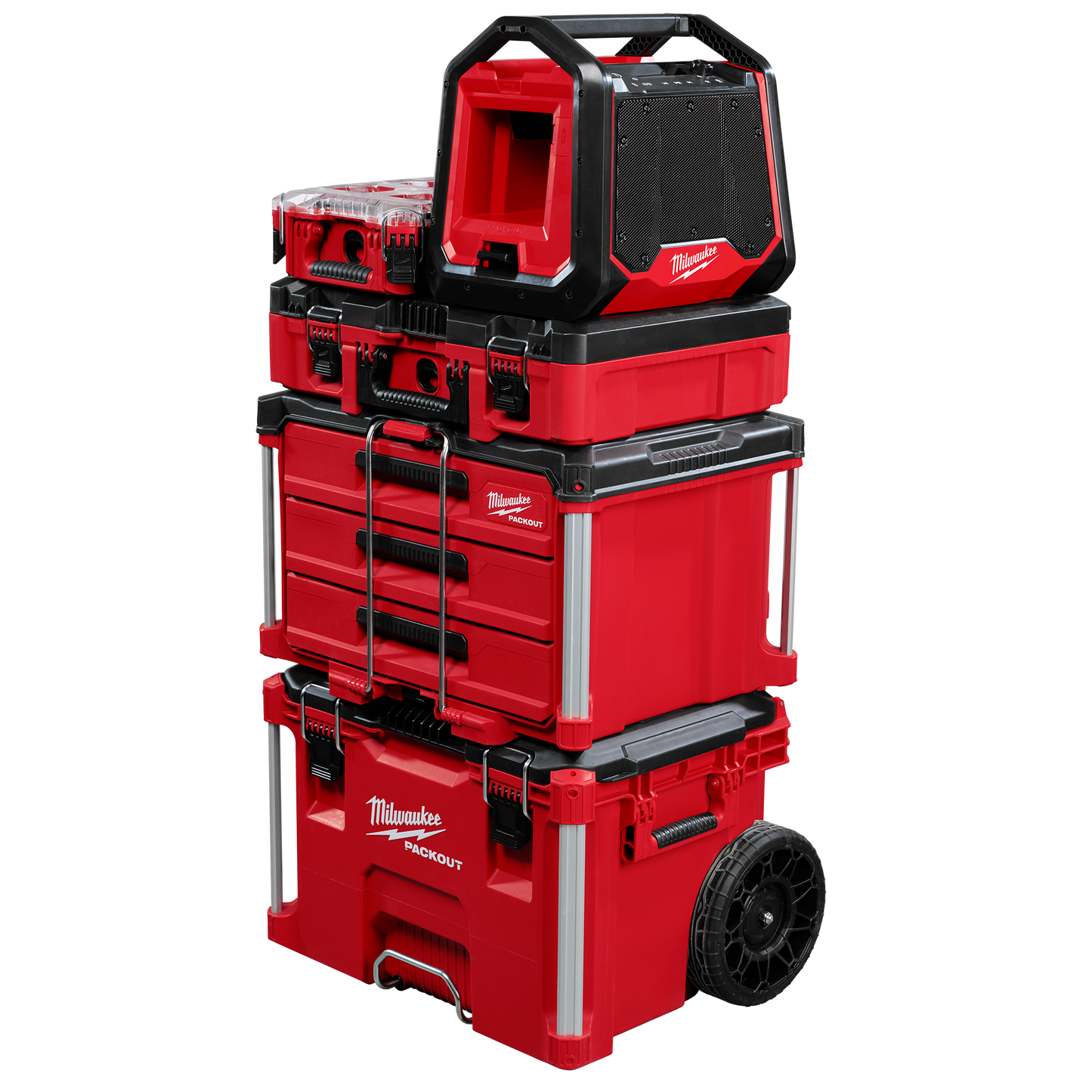 Stacked red and black Milwaukee PACKOUT modular storage units with large wheels and a compact Bluetooth jobsite radio on top, part of power tool accessories at Hartville Hardware.