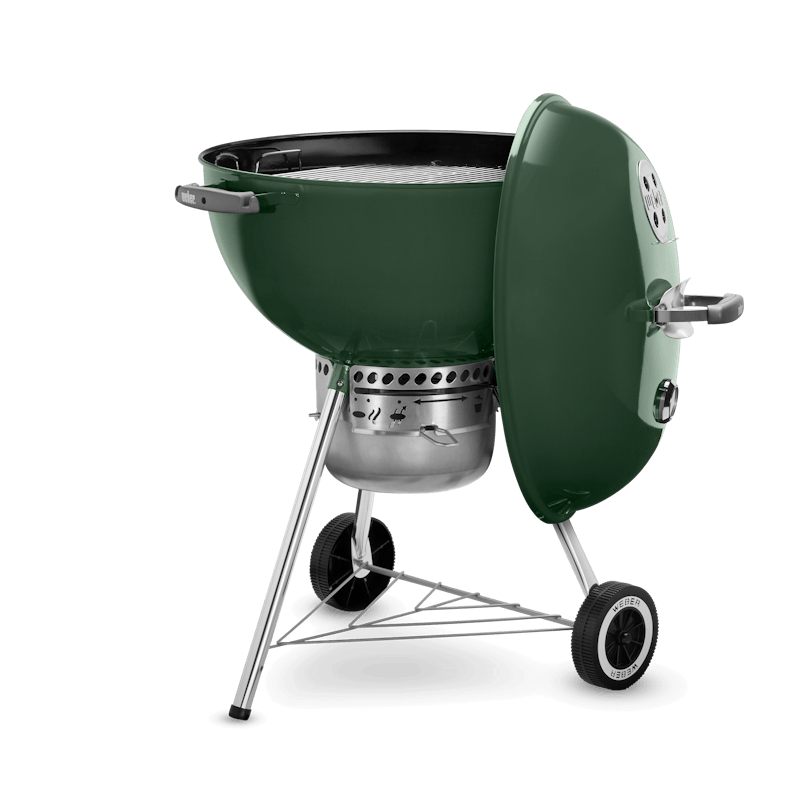 Green kettle-style charcoal grill with vented lid, wheels, and metal legs for outdoor cooking and grilling collections