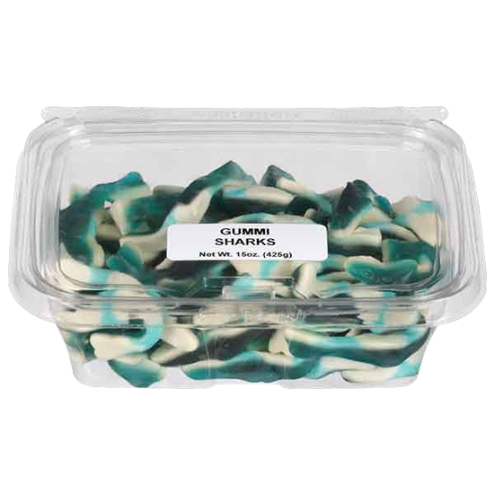 Clear plastic container filled with blue and white shark-shaped gummy candies from candy collection
