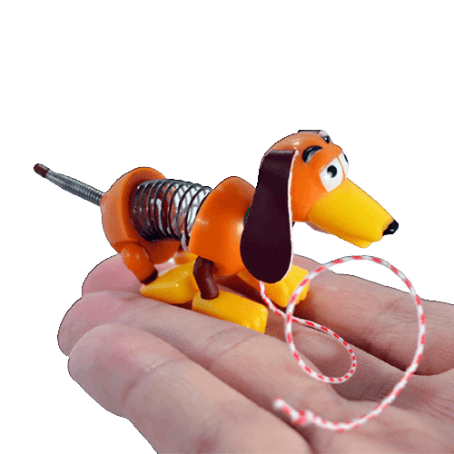 Miniature orange and yellow spring toy dog with leash in hand for pretend play and toys & games collections