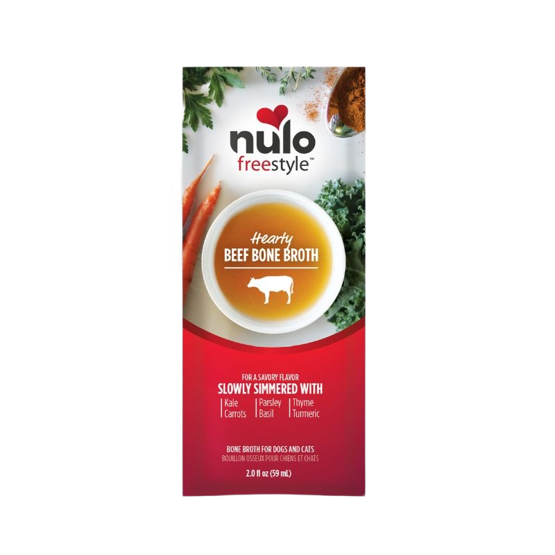 Carton of Nulo Freestyle hearty beef bone broth with herbs and vegetables on white background
