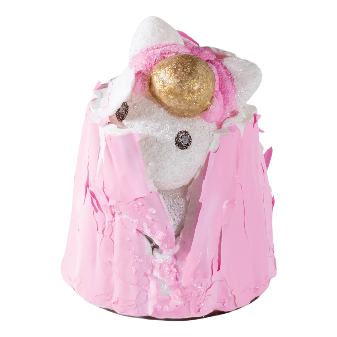 White foam unicorn figure with golden horn and pink coating partially peeled for interactive growing activity