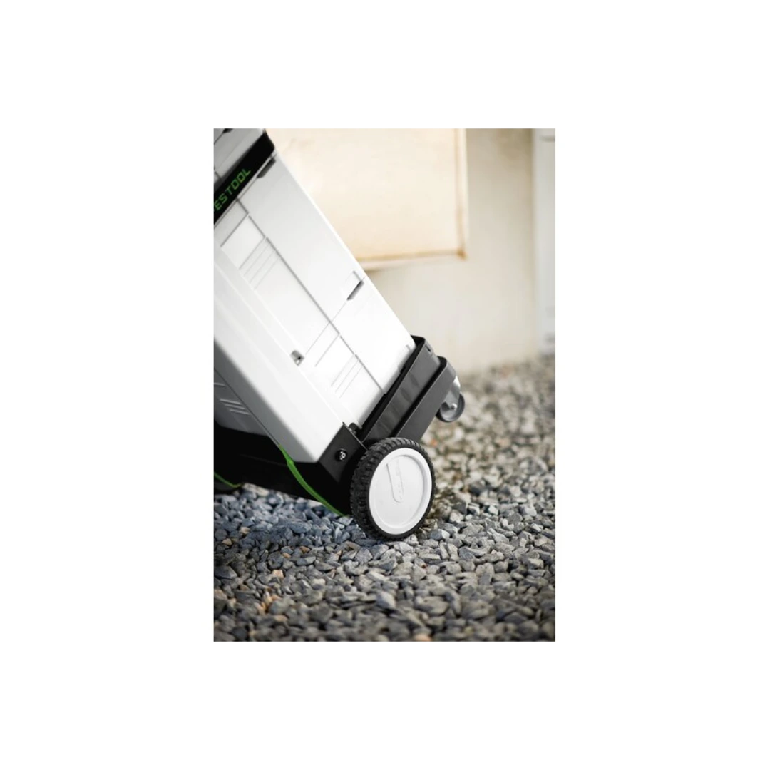 Close-up of rugged wheel on compact storage dolly designed for transporting interlocking tool cases on rough terrain