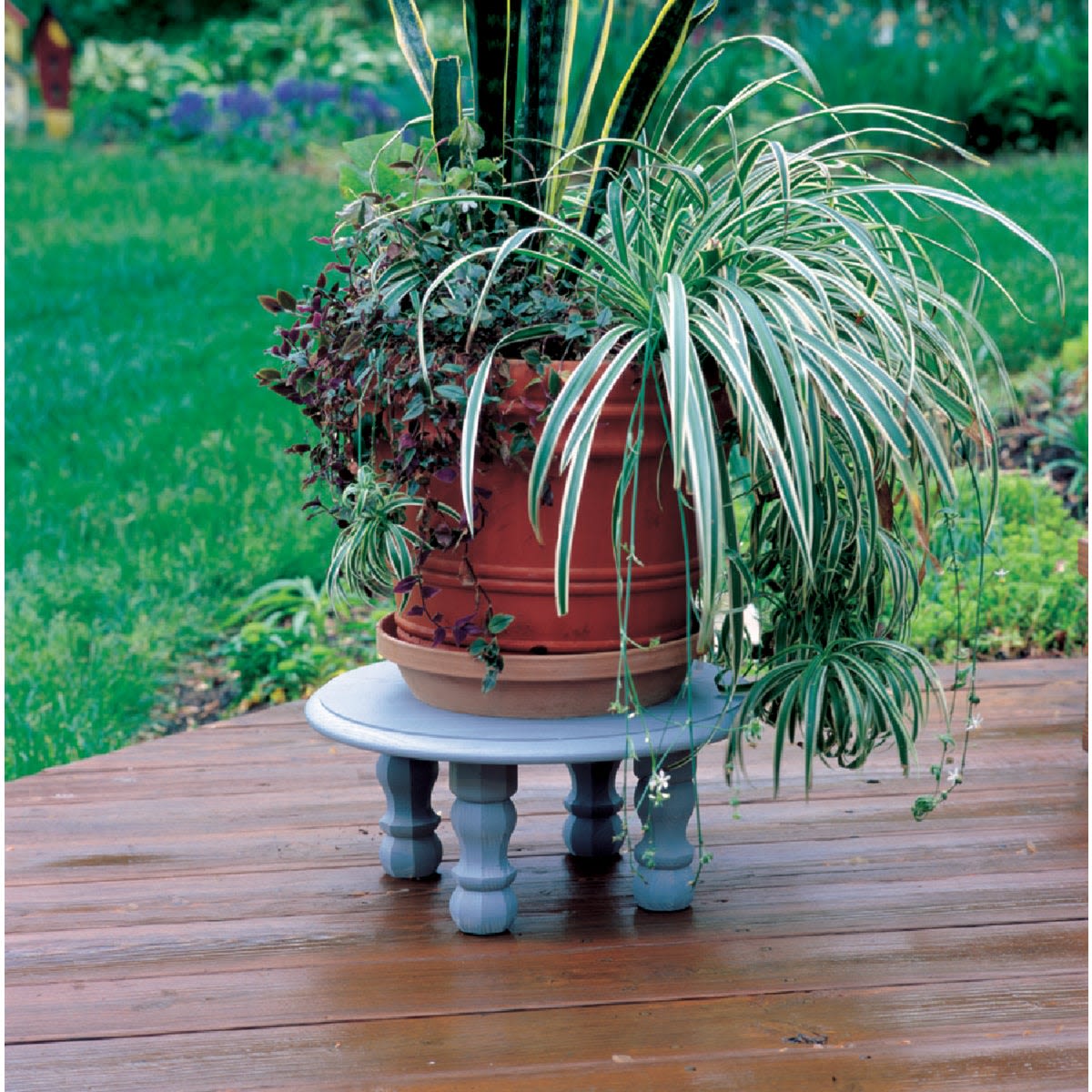 Small traditional pine table leg painted gray used as a plant stand for home improvement and furniture accessories