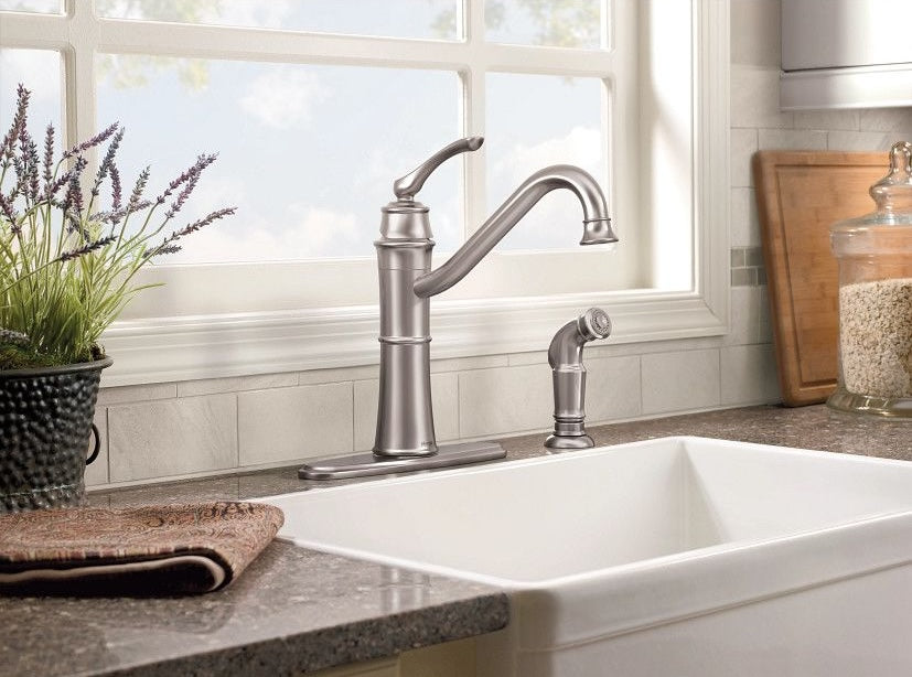 High-arc stainless steel kitchen faucet with single handle and side sprayer in a modern home improvement setting