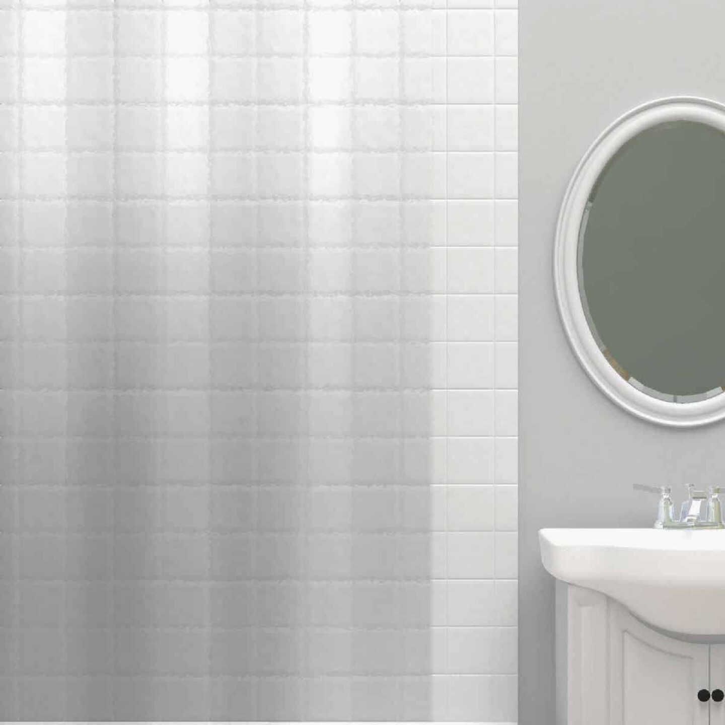 Clear textured shower curtain liner hanging against white tiled shower wall in a modern bathroom setting