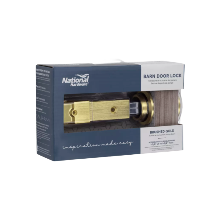 Brushed gold barn door lock with bolt displayed in retail packaging for tools and home improvement projects