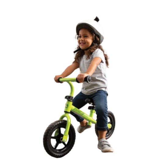Young child wearing a helmet riding a green balance bike for toys and games under $100 and vehicles collections