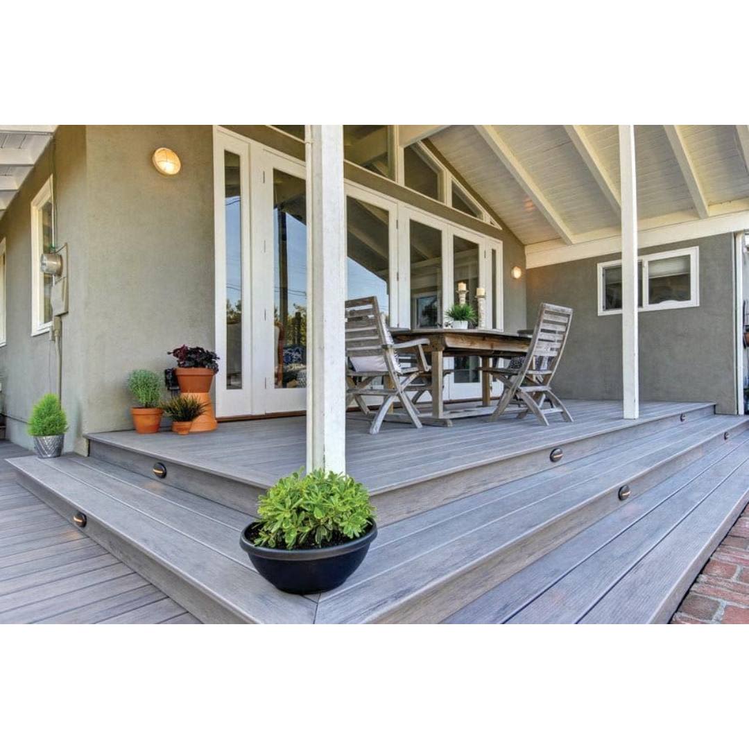 Spacious covered porch with grooved ashwood composite decking and outdoor seating for home improvement projects