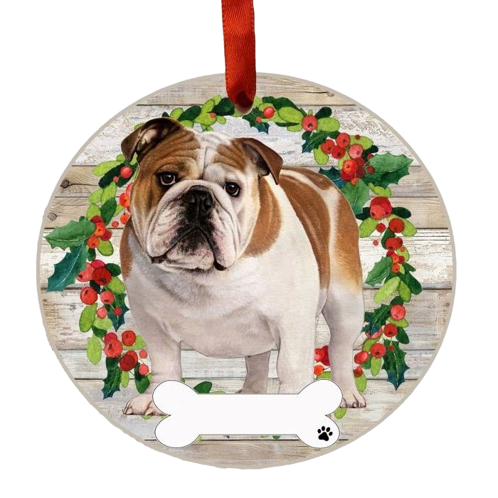 Round Christmas ornament featuring a brown and white bulldog inside a festive holly wreath with bone-shaped nameplate