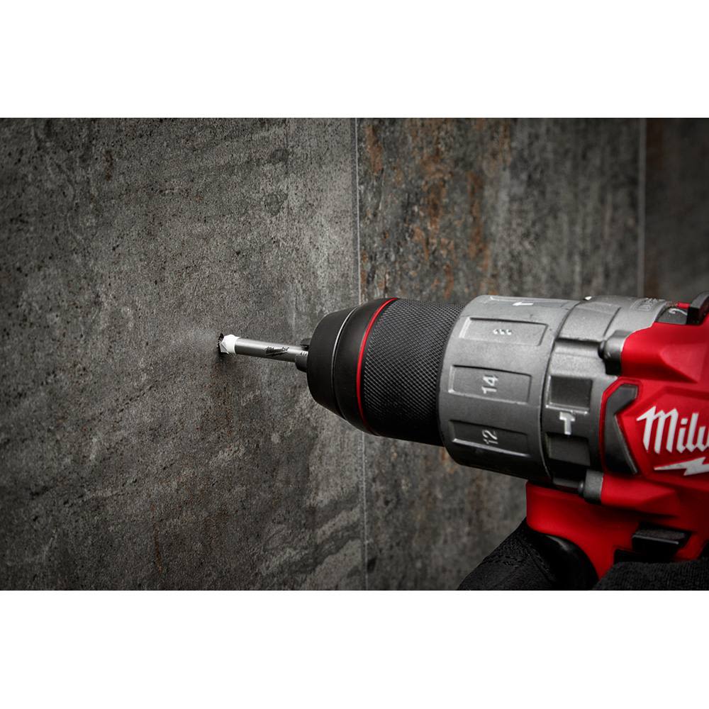 Power drill with 1/4 inch tile and stone bit drilling into dark textured tile for home improvement projects