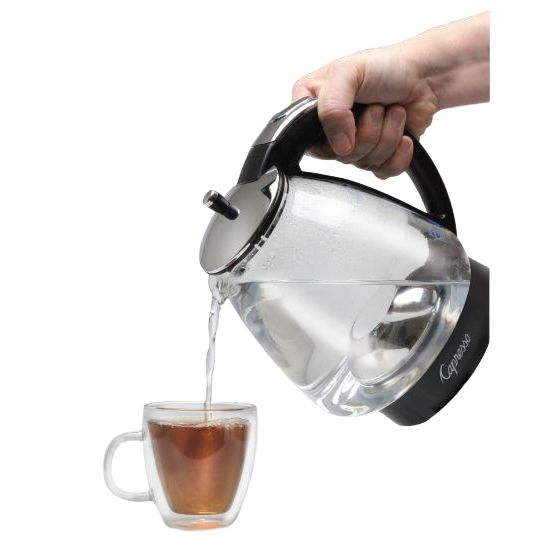 Hand pouring hot water from Capresso glass kettle with black handle into clear glass cup with tea inside