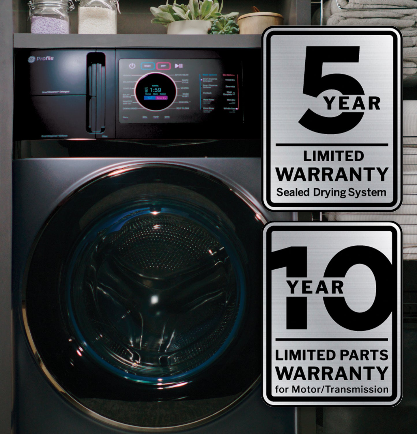 Dark gray GE Profile front-load washer/dryer combo showing digital controls with warranty badges for drying system and motor parts