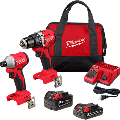 Two compact red cordless power tools with batteries, charger, and red carrying bag for tools and home improvement use