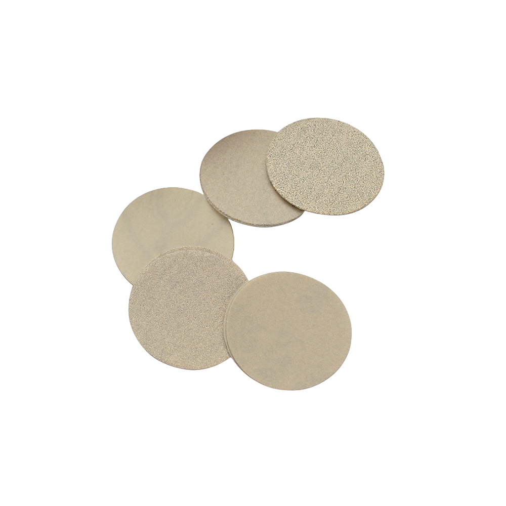 Set of five beige 3-inch sanding discs with 60 grit abrasives for woodworking tools and home improvement projects.