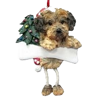Decorative Yorkipoo dog ornament with dangling legs holding a white bone and small Christmas tree detail