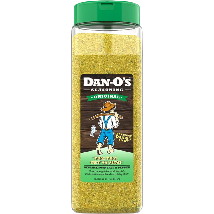 Clear plastic container of original yellow seasoning blend with green lid for versatile cooking use