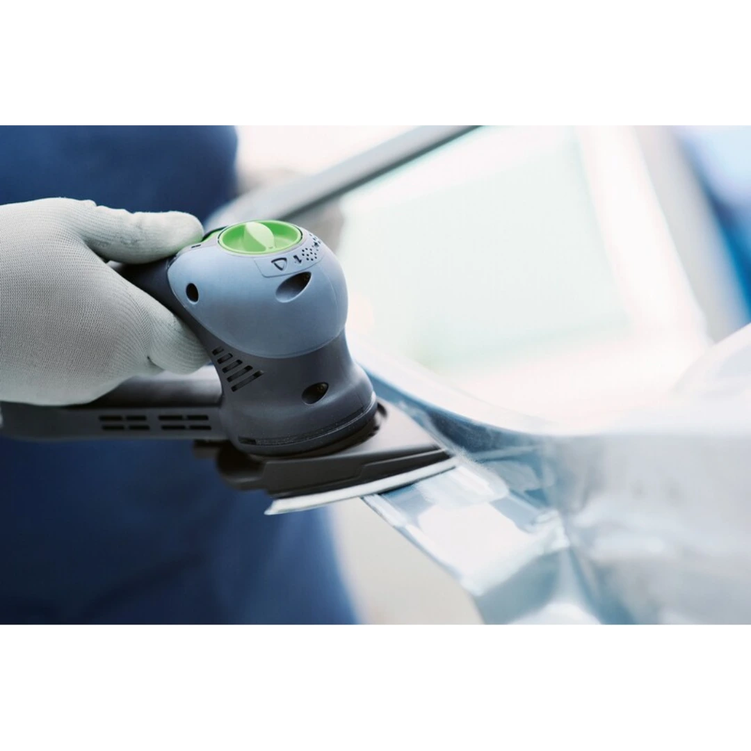 Power tool with Festool extended delta sanding pad smoothing tight corners on a painted surface in woodworking accessories
