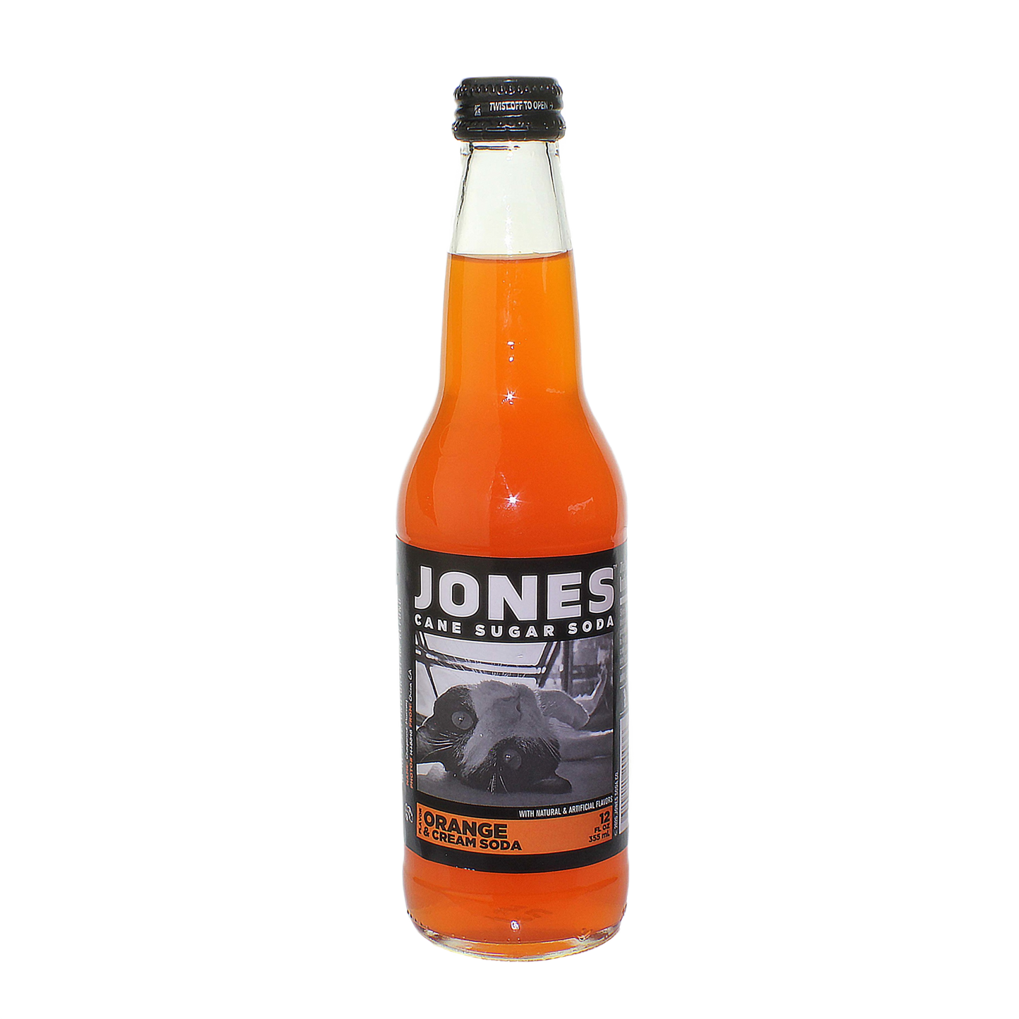 Glass bottle of Jones orange and cream soda with black and white label featuring a cow image