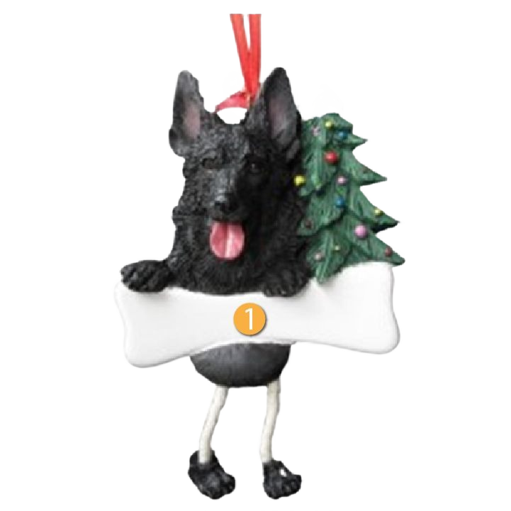 Black German Shepherd Christmas ornament with dangling legs holding a decorated tree and bone for holiday decor collections
