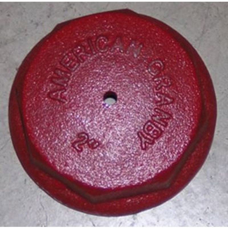 Red cast iron octagonal drive cap with small center hole for tools and home improvement tasks
