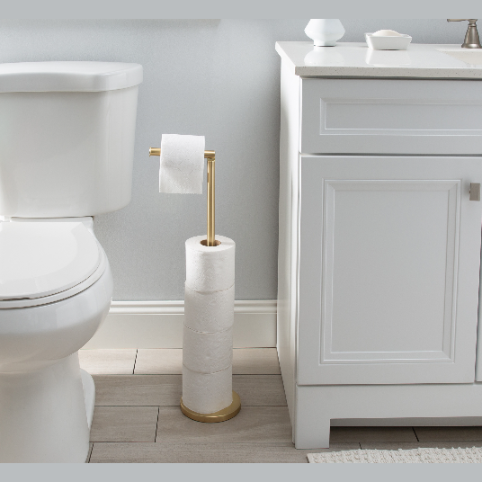 Gold freestanding toilet paper holder with storage rod for up to five rolls in bathroom accessories collections