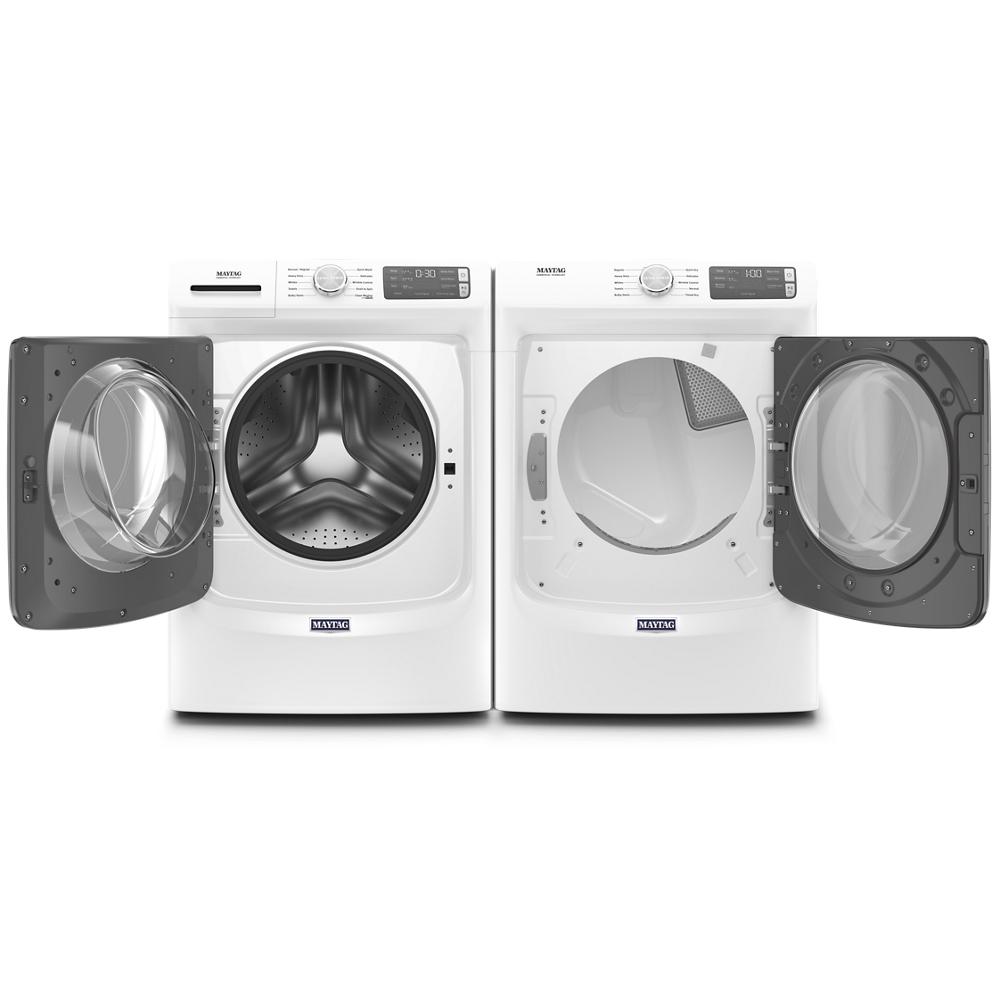 White front load washer and dryer set with open doors showcasing stainless steel drum and lint filter in washers and appliances collection