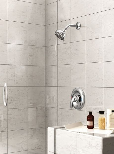 Chrome shower trim with single-handle lever installed in tiled shower for home improvement projects