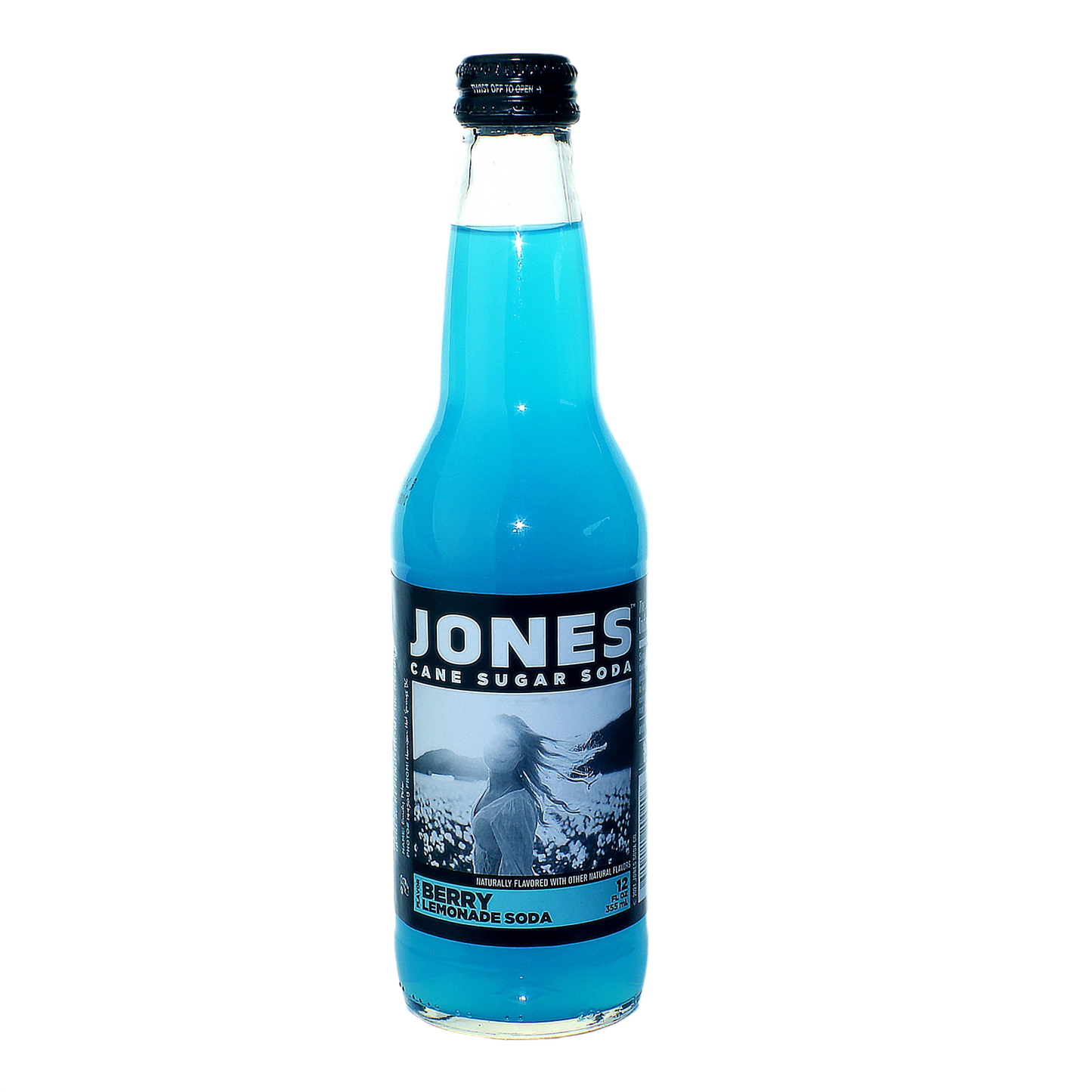 Glass bottle of bright blue Jones Berry Lemonade Soda with black and white label and black cap on plain background