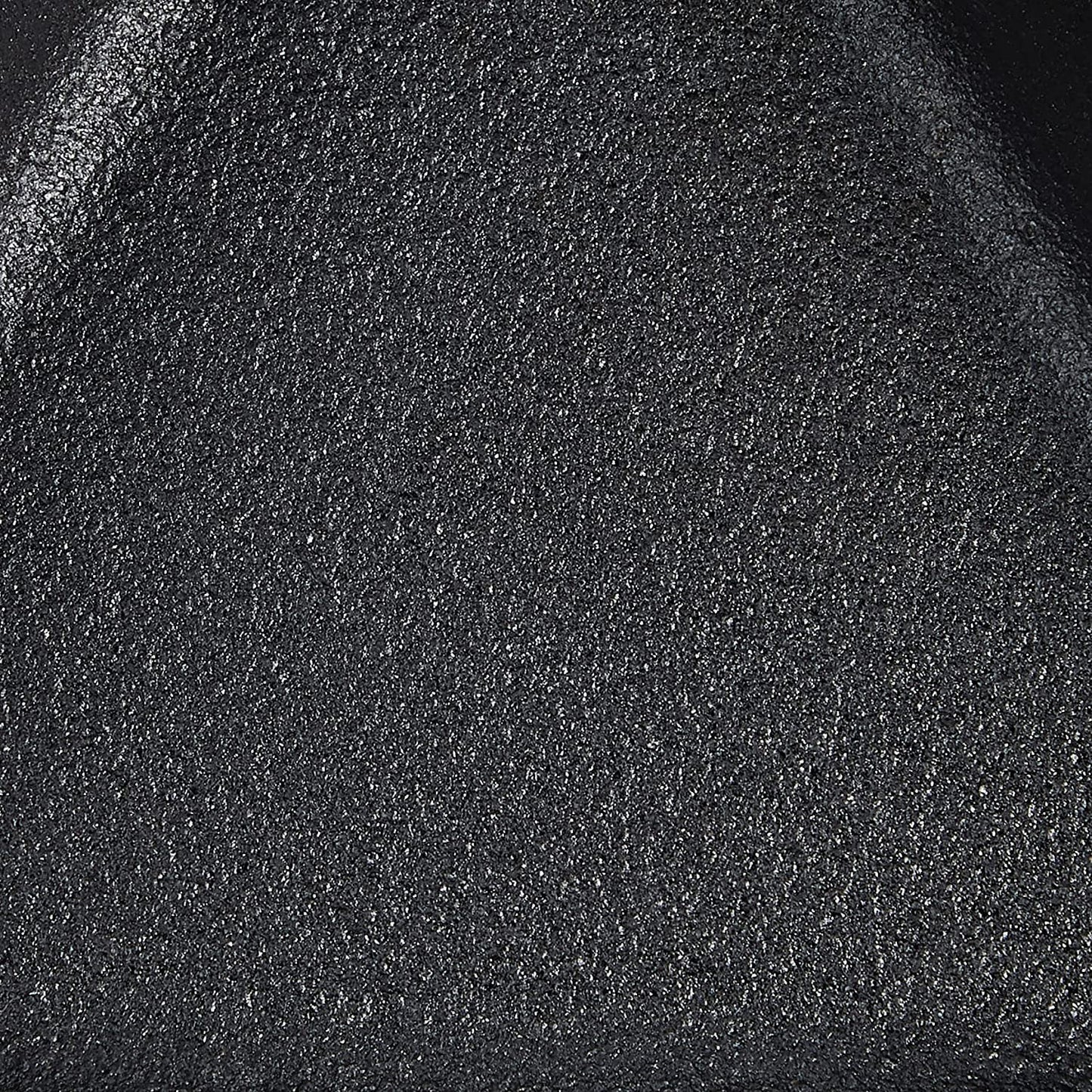 Close-up of textured black cast iron surface for kitchenware in under $50 and kitchenware collections
